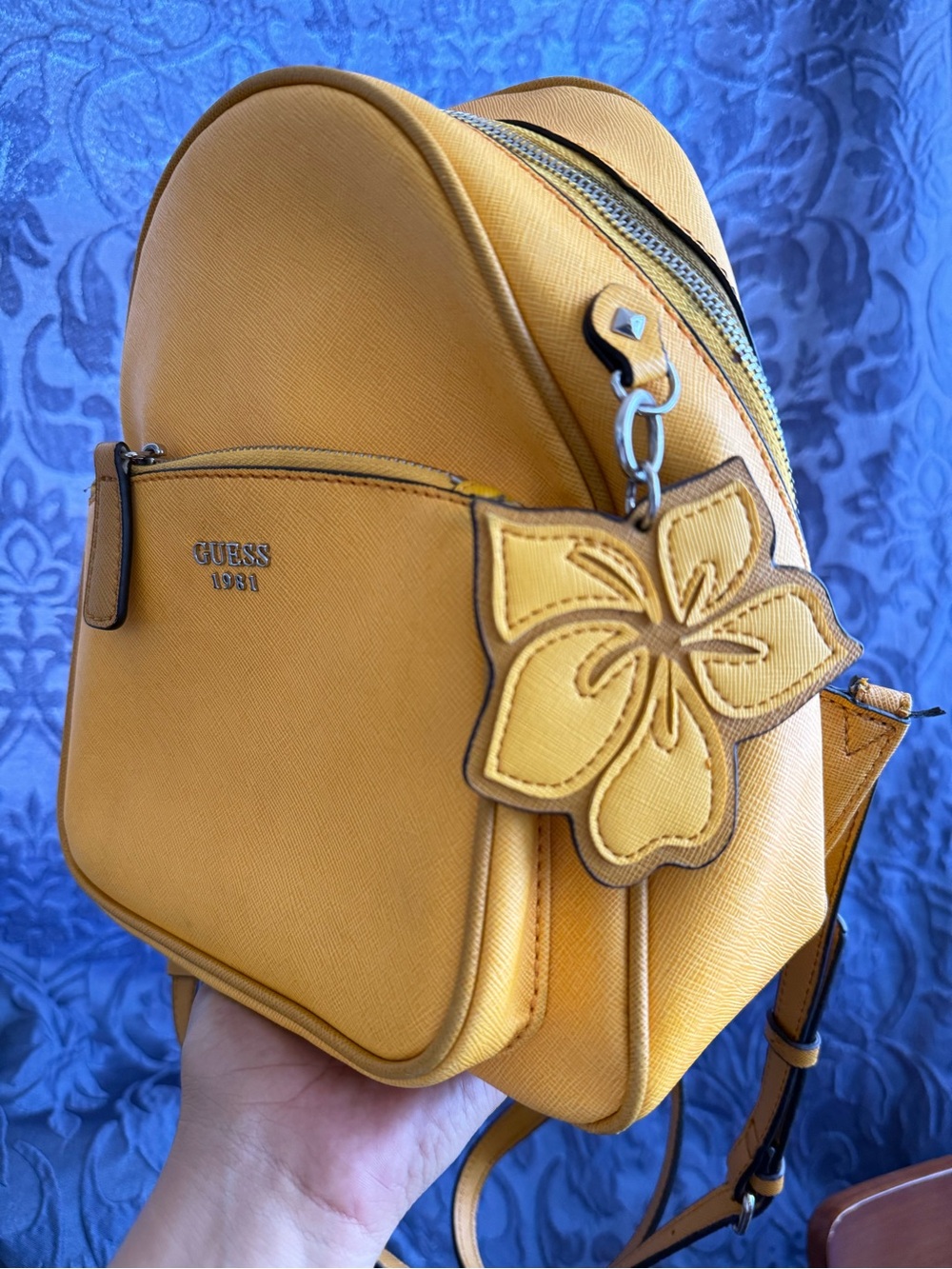 GUESS mustard yellow mini backpack with floral charm